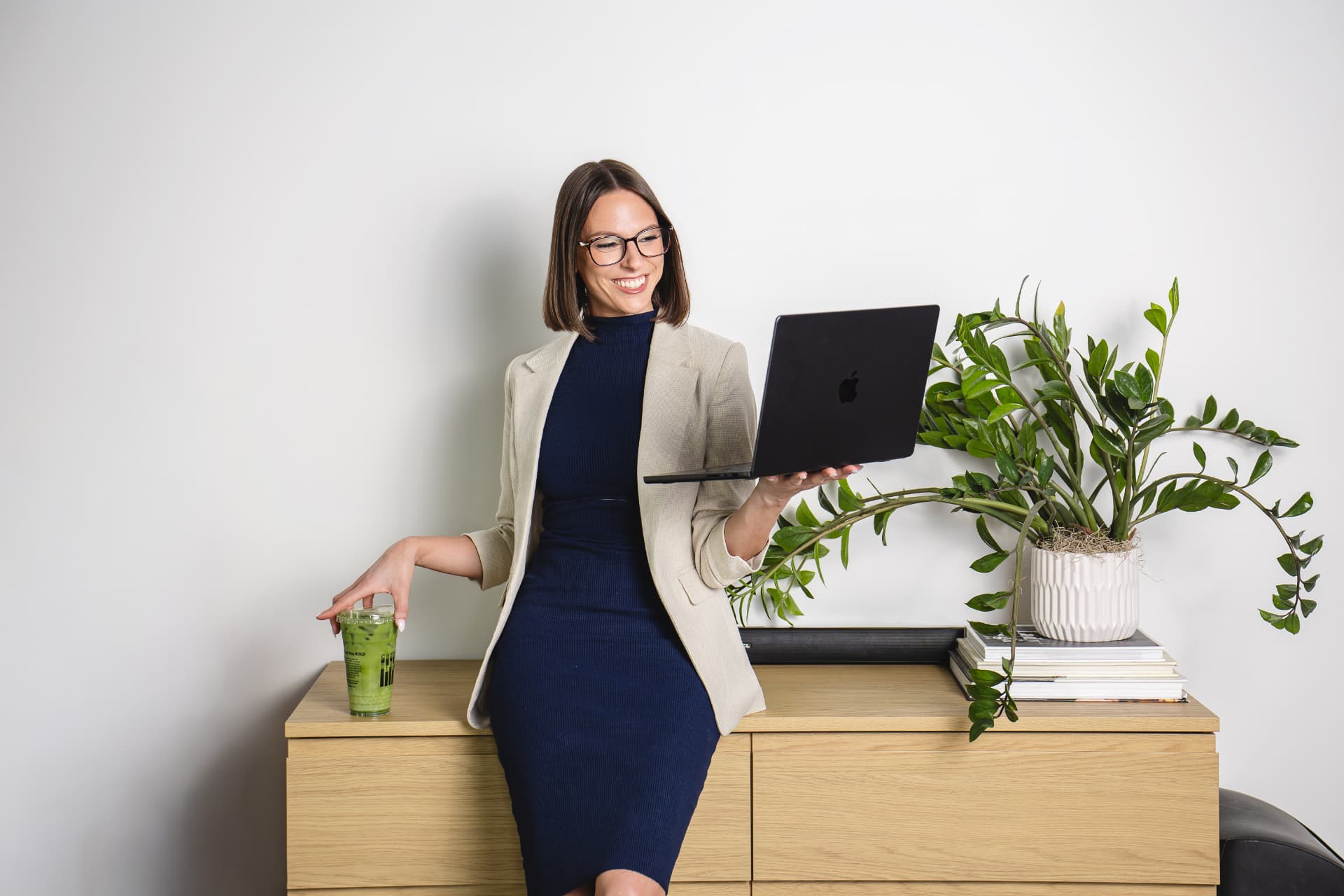 Krista working on her online business with matcha