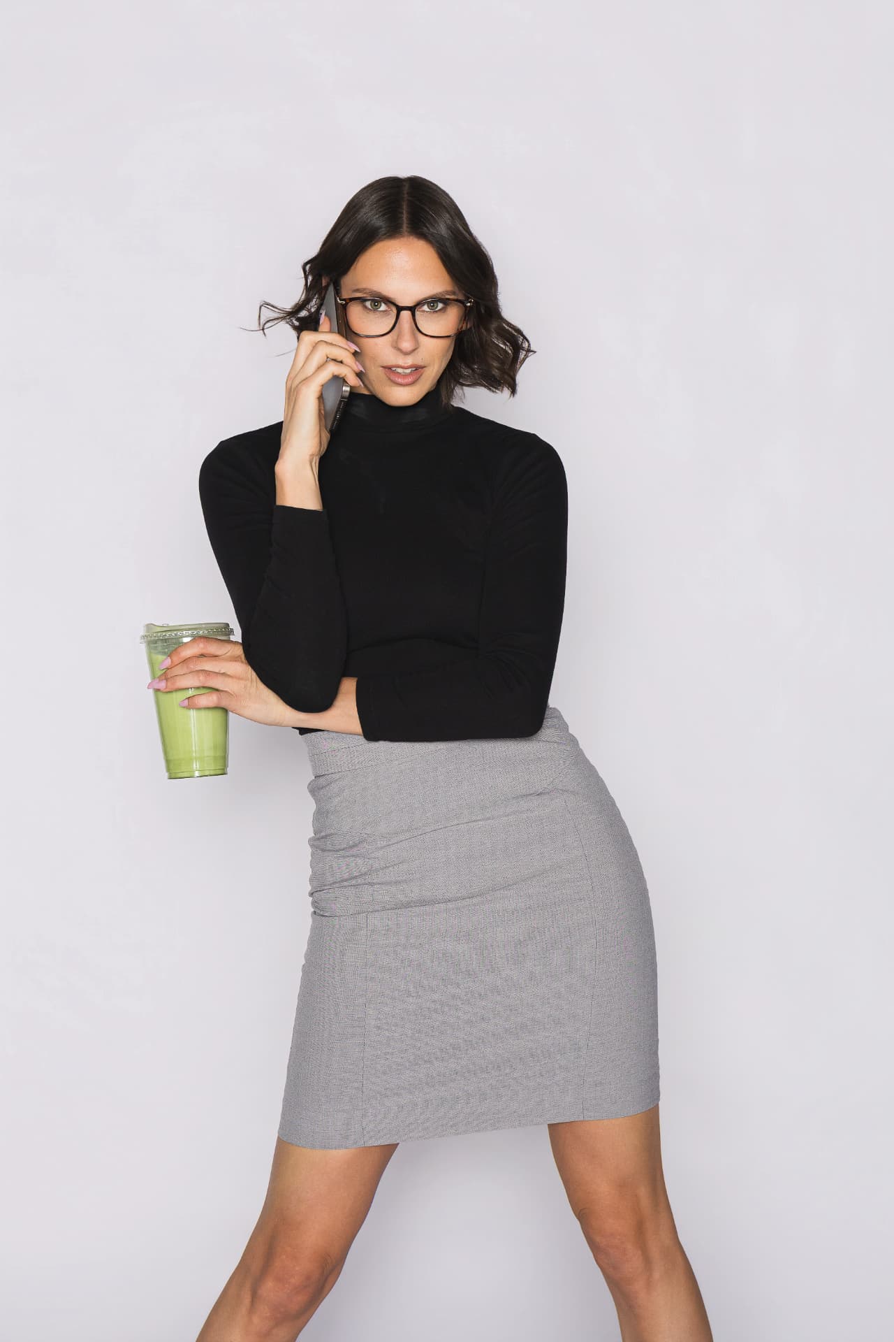 Krista holding her matcha and phone